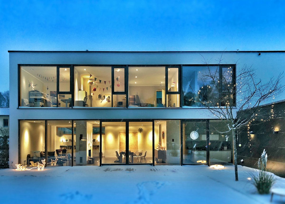 Two-story home with large windows